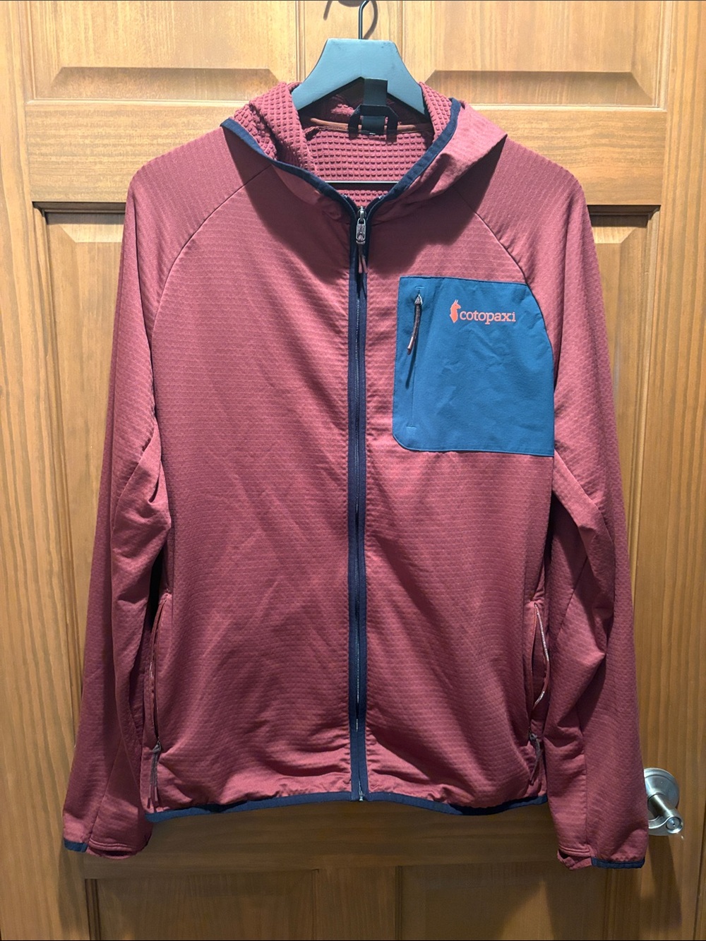 cotopaxi Men's Hooded Performance Jacket - Brick Red with Blue Pocket